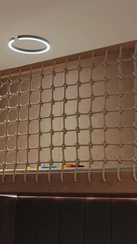 Vertical video. Childrens loft bed with climbing wall and safety net for extra Stock Footage 311261519