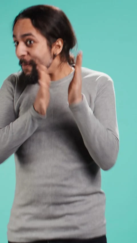 Vertical video Chipper joyful man happily clapping hands, eager to receive good Stock Footage 314514795