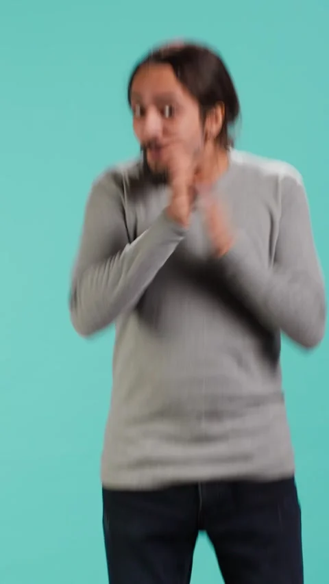 Vertical video Chipper joyful man happily clapping hands, eager to receive good Stock Footage 314516516