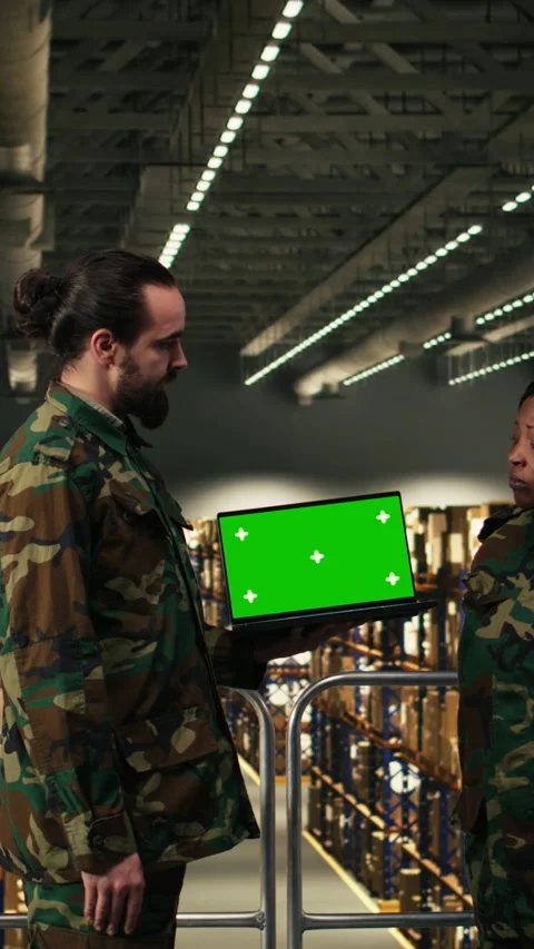 Vertical Video Chroma key on laptop near army soldiers team operating in Stock Footage 330439191
