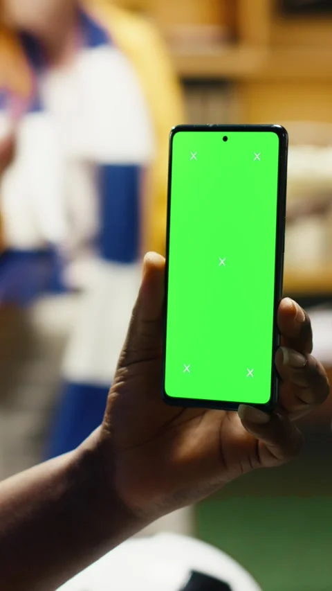 Vertical video Chroma key phone used by happy football fans watching match Video stock 338186374