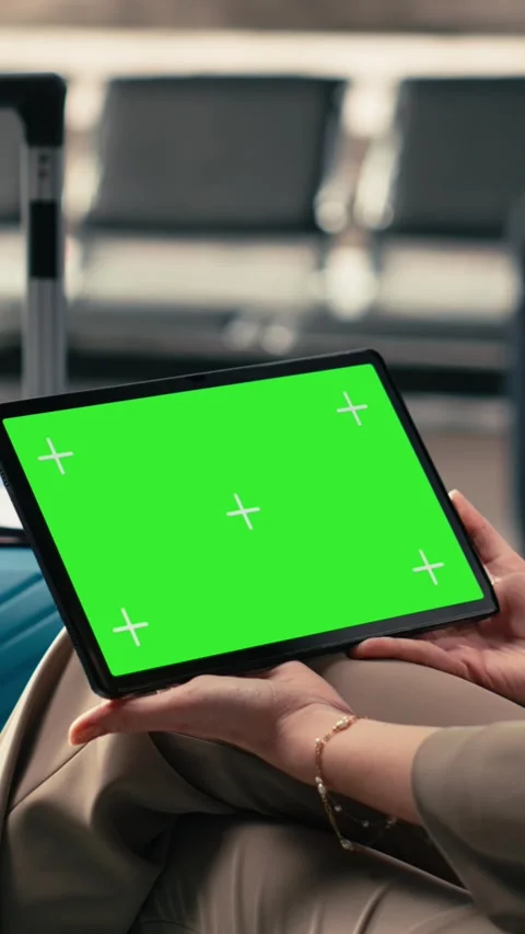 Vertical Video Chroma key screen on tablet with group of people waiting in Stock Footage 333613059