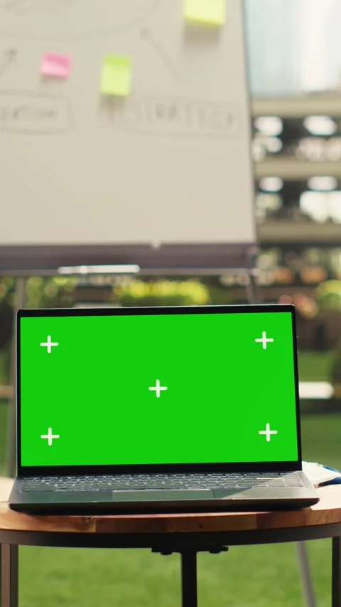 Vertical Video Chroma key screen replacement on laptop in empty modern office Stock Footage 339069844