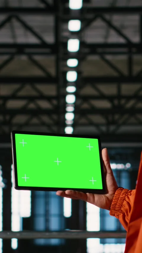 Vertical Video Chroma key tablet, engineer with hard hat, heavy industry Stock Footage 330085182