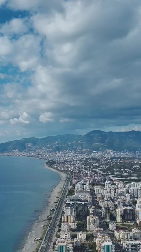 Vertical Video: City View With the Ocean and Blue Sky Forming a Beautiful and Stock Footage 342898265