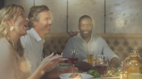 Vertical video: Clapping woman at left sparking laughter and toasting with wine Stock Footage 333904642