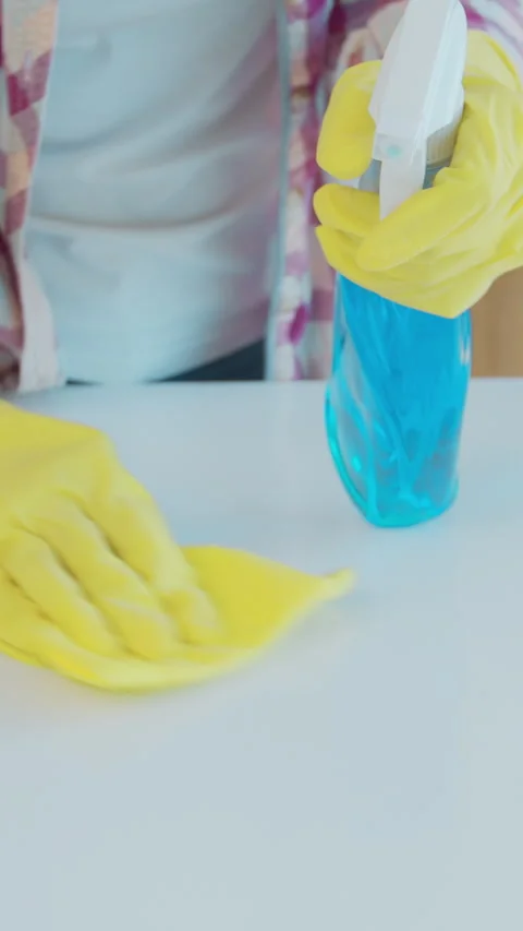 Vertical Video Cleaning the kitchen. Housekeeper washes the kitchen table. Stock Footage 337992322