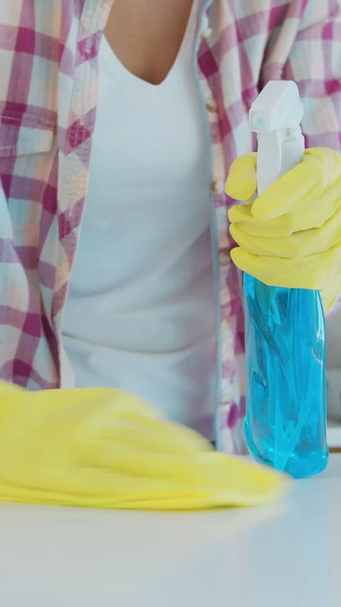 Vertical Video Cleaning the kitchen. Housekeeper washes the kitchen table. Stock Footage 337992421