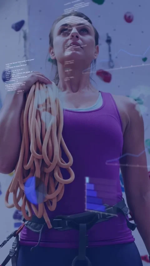 Vertical video: Climber securing rope checking harness scanning wall as AR Stock Footage 334397882