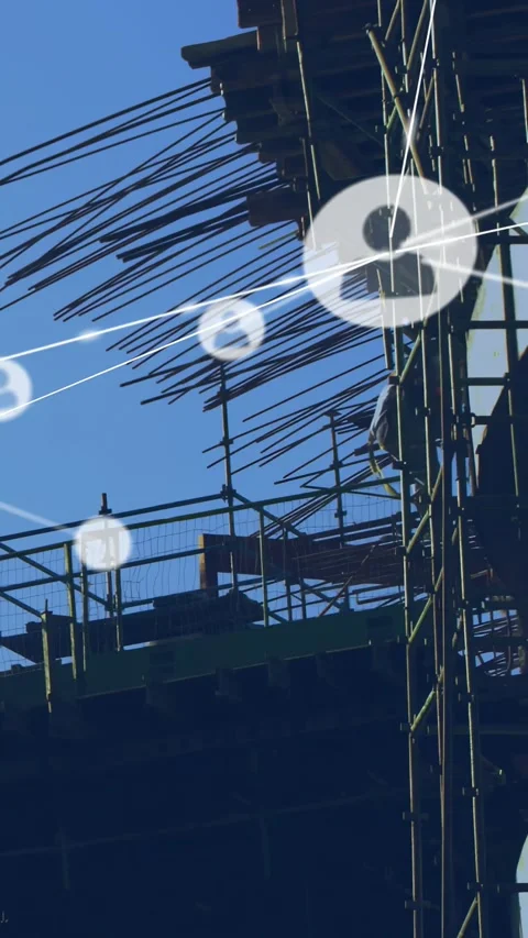 Vertical video: Climbing site workers wearing hard hats securing rebar on slab Stock Footage 330542725
