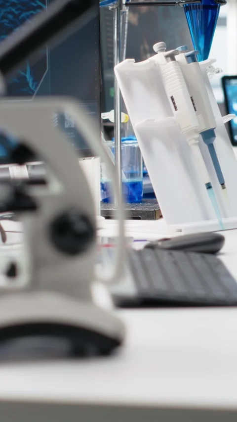 Vertical video Clinical microscope used for sample examination in hospital Stock Footage 319595571