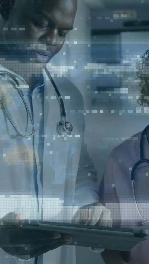 Vertical video: Clinicians sharing tablet, tapping screen and activating data Stock Footage 333821538