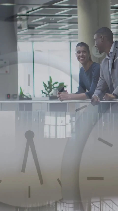 Vertical video: Clock overlay appearing framing business team leaning on railing Stock Footage 329913173