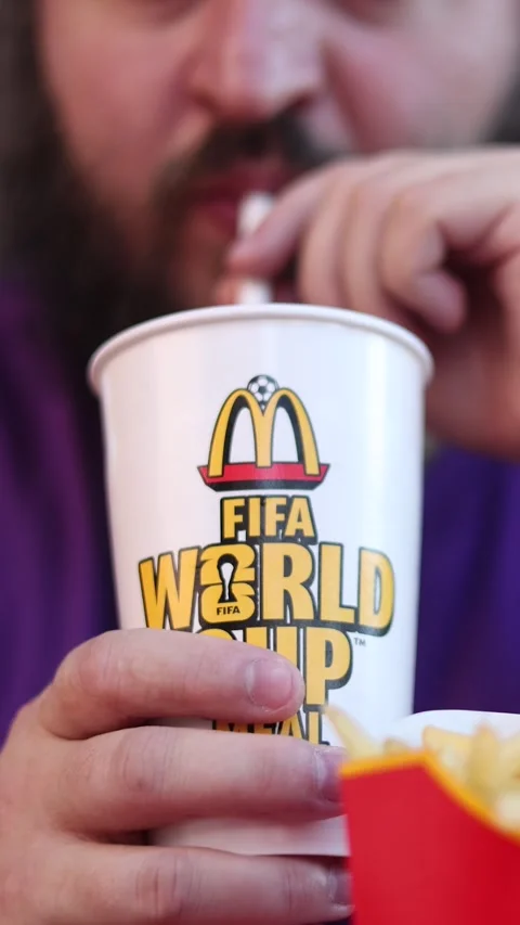Vertical video close up. 60 fps. Unknown white fat man drinks lemonade Stock Footage 339038851