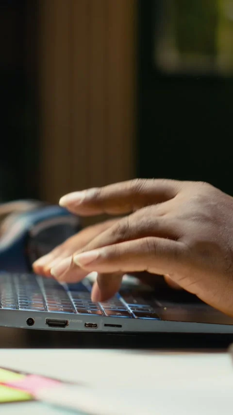 Vertical Video Close up of black worker proofreading and fact checking financial Video stock 319451974