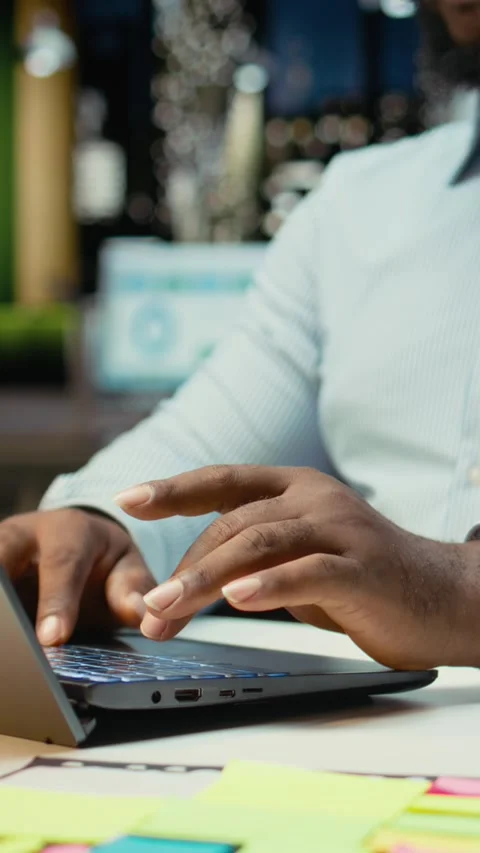 Vertical Video Close up of black worker proofreading and fact checking financial Video stock 319594529