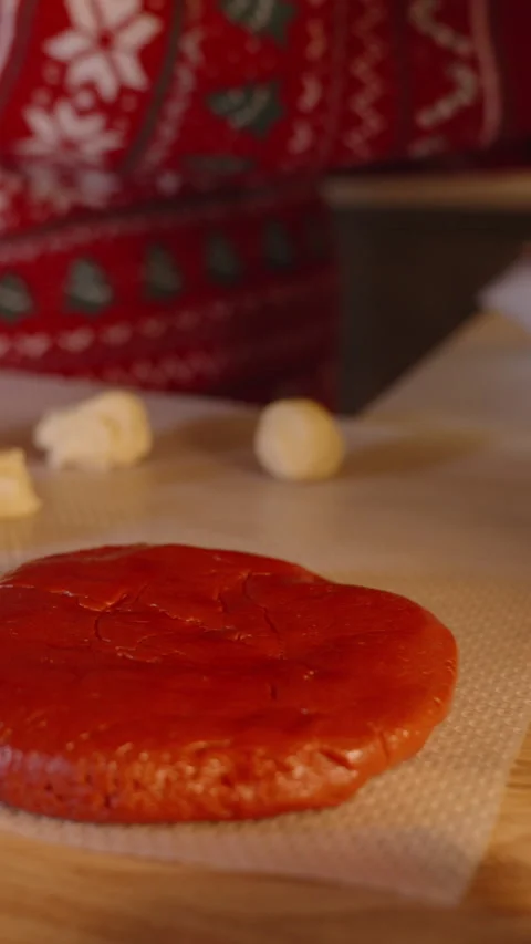 Vertical video. Close Up of Cookie Dough Balls and Red Dough on Baking Sheet Stock Footage 316809688