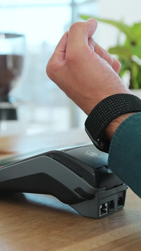 Vertical video. Close up customer for coffee paying with an NFC contactless Stock Footage 343768103