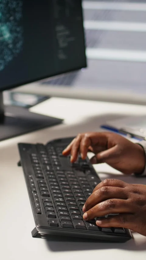 Vertical video Close up of data center admin coding on PC, typing on computer Stock Footage 309487931
