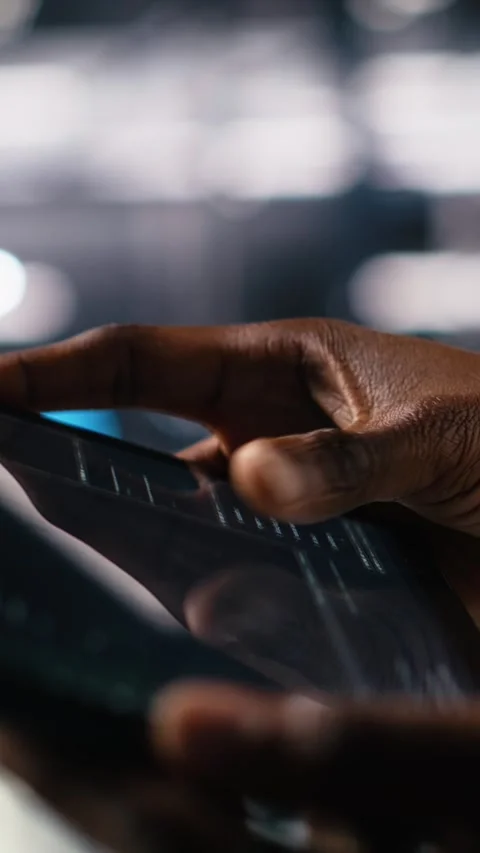 Vertical video Close up of data center programmer using tablet, writing code Stock Footage 313456088