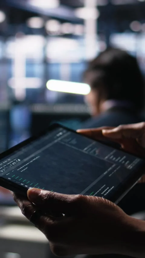 Vertical video Close up of data center programmer using tablet, writing code Stock Footage 313456730