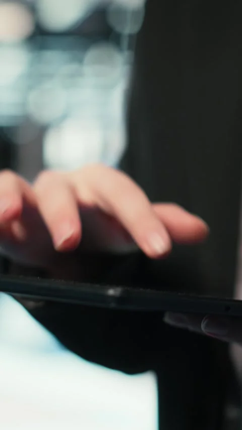 Vertical video Close up of data center cybersecurity analyst using tablet to Stock Footage 329319576