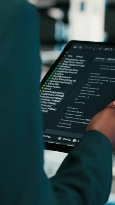 Vertical video Close up of data center programmer using tablet app to write code Stock Footage 329530027