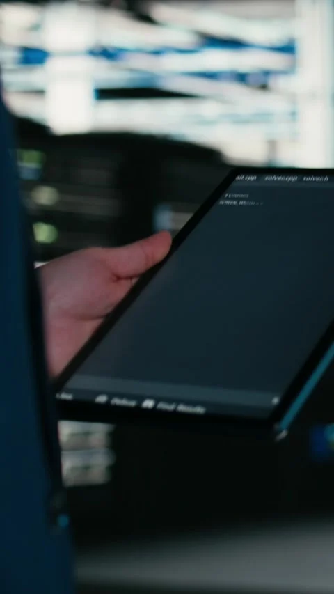 Vertical video Close up of data center engineer using tablet to write code Stock Footage 329713756
