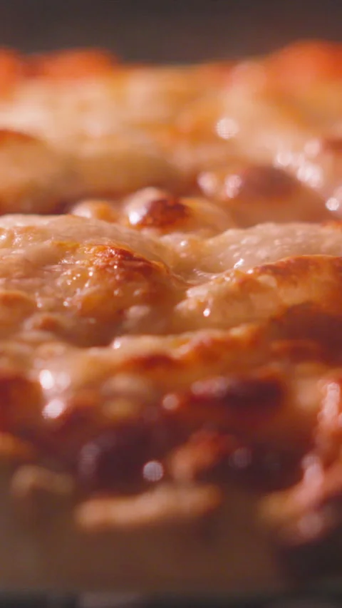Vertical Video Close-up of Delicious Cheese and Tomato Margherita Pizza with Stock Footage 336703249