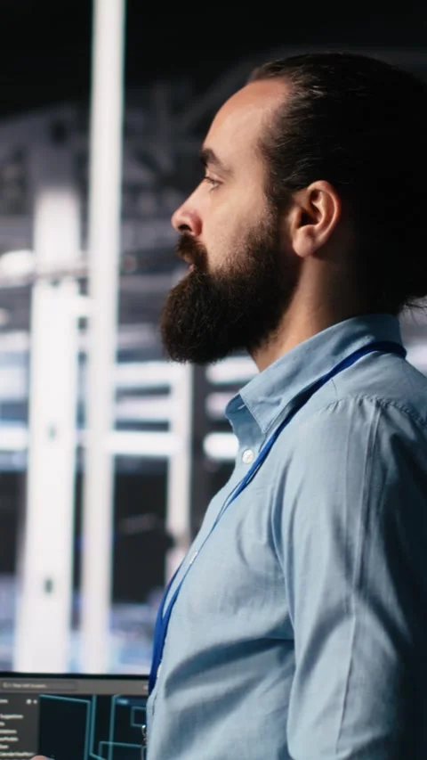 Vertical video Close up of developer in data center coding with generative AI on Stock Footage 313507480