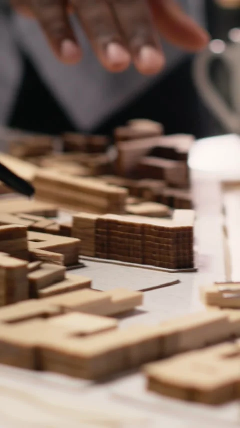 Vertical Video Close up of developers work together on layout city planning Stock Footage 316184792