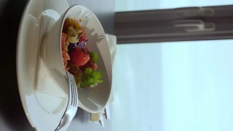 Vertical video. close-up of a dish of baked eggplant with tomatoes on the table Stock Footage 155248913