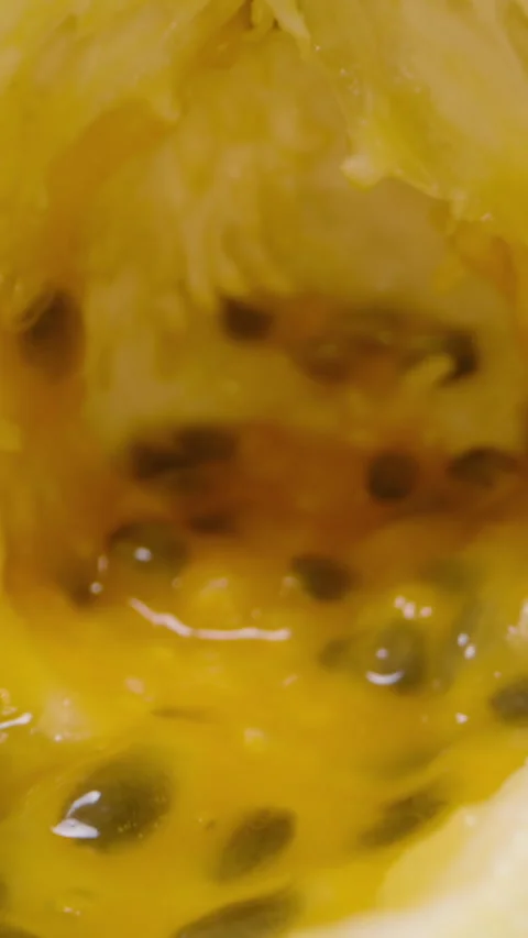 Vertical video. Close Up Dolly Slider View of Empty Passion Fruit Shells With Stock Footage 314410938