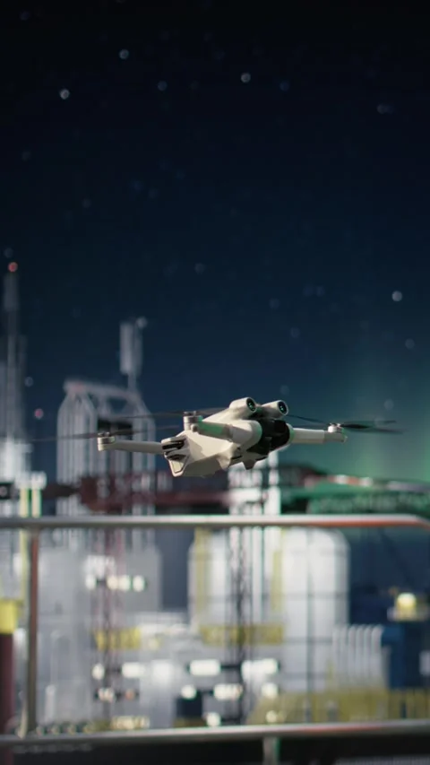 Vertical video Close up of drone used by men on offshore platform dodging Stock Footage 339887332