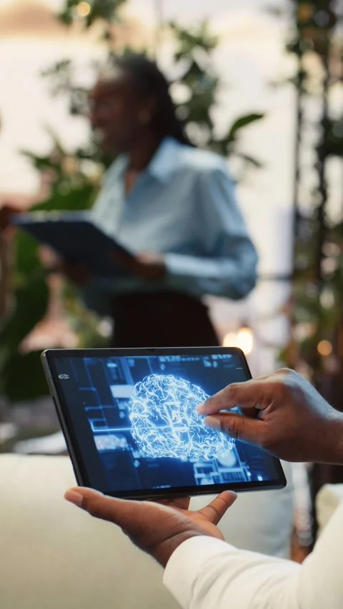 Vertical video Close up of employee using tablet touchscreen to interact with AI 動画素材 345166771