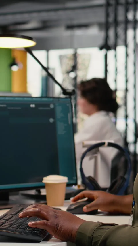 Vertical video Close up of engineer in office using AI LLM chatbot to get help Stock Footage 323331023