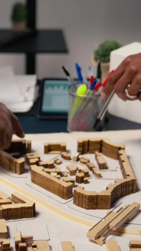 Vertical Video Close up of engineers team creating the property layout for site Stock Footage 316341843