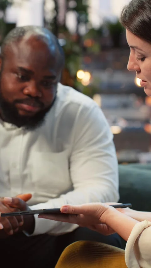 Vertical video Close up of entrepreneurs assisted by AI model on tablet Video stock 345166757