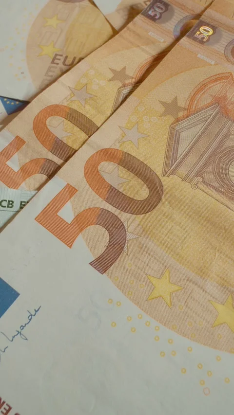 Vertical video Close up of Euro banknotes showcasing detailed features and Stock Footage 327596920