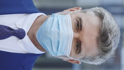 Vertical Video. Close Up of Face of Mature Caucasian Handsome Boss in Medical Stock Footage 250414486
