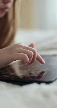 Vertical video. Close-up finger scrolling social media. Girl browsing digital 스톡 사진