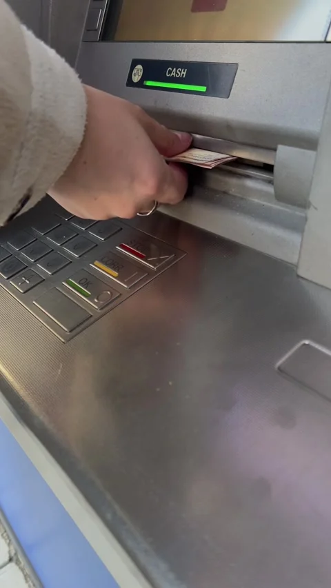 Vertical video close up. Gray metal ATM opens lid to dispense cash money Stock Footage 300652696