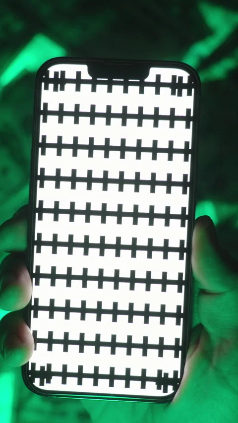 Vertical video. Close-Up of Hands Executing a Zoom Gesture on a Smartphone Video stock 296368396