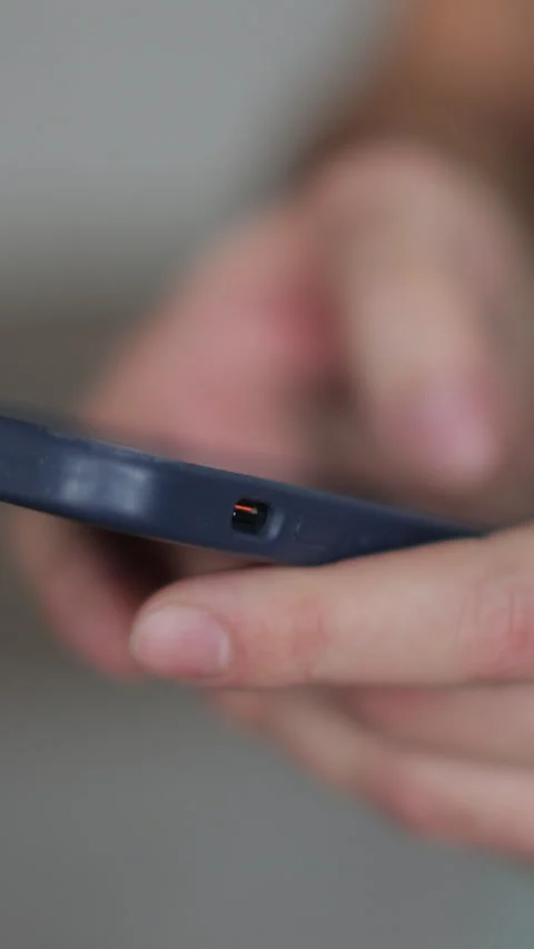 Vertical video Close up of hands of man writes a text message on smartphone Stock Footage 337650913