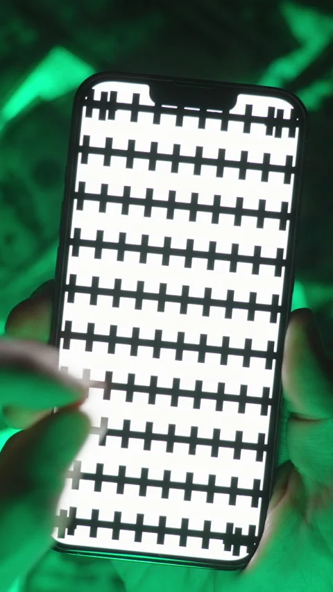 Vertical video. Close-Up of Hands Performing a Pinch Gesture to Minimize an Stock Footage 296368460