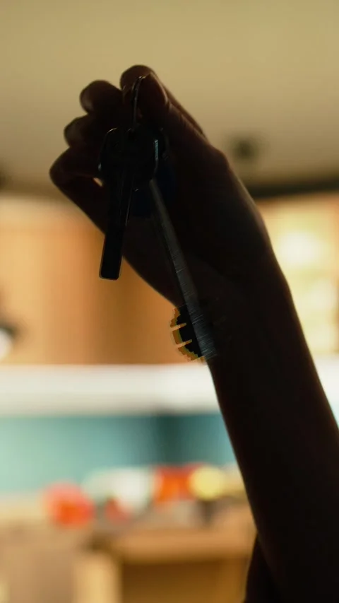 Vertical Video Close up of house keys representing satisfaction of buying Stock Footage 343349227