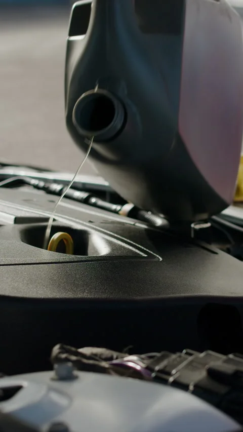 Vertical video. Close-up image of a car oil container. A person in the car Stock Footage 280029699