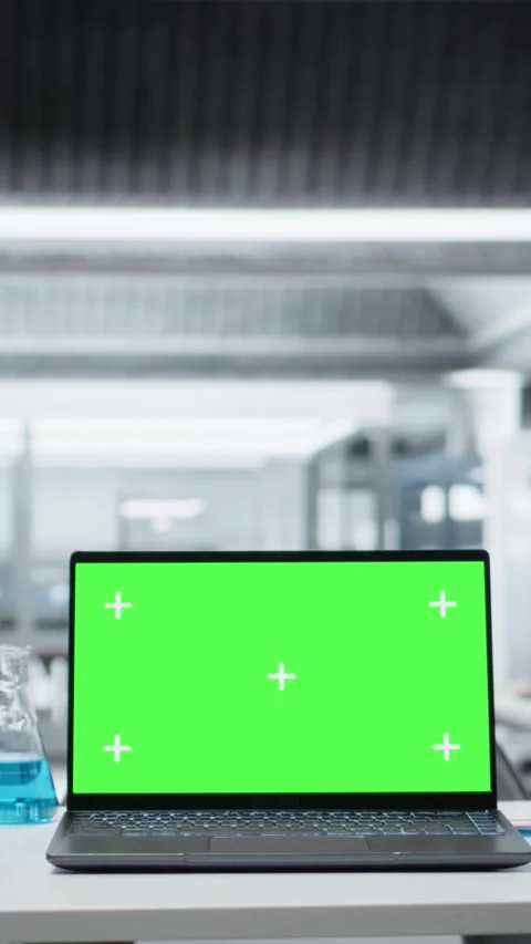Vertical video Close up of isolated screen laptop on workbench in sterile empty Stock Footage 326011158