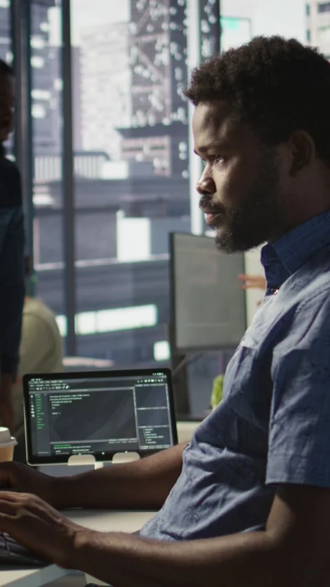 Vertical video Close up of IT expert programming in office using PC Stock Footage 319486375