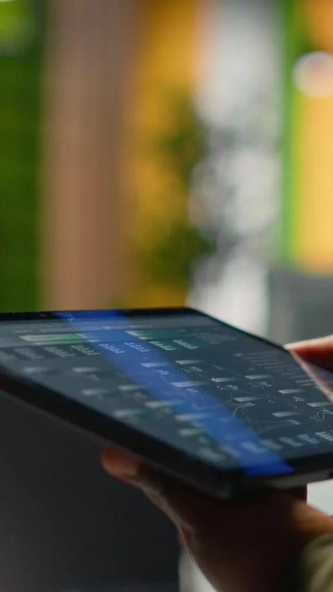 Vertical video Close up of IT professional in startup office working on tablet Stock Footage 323331310